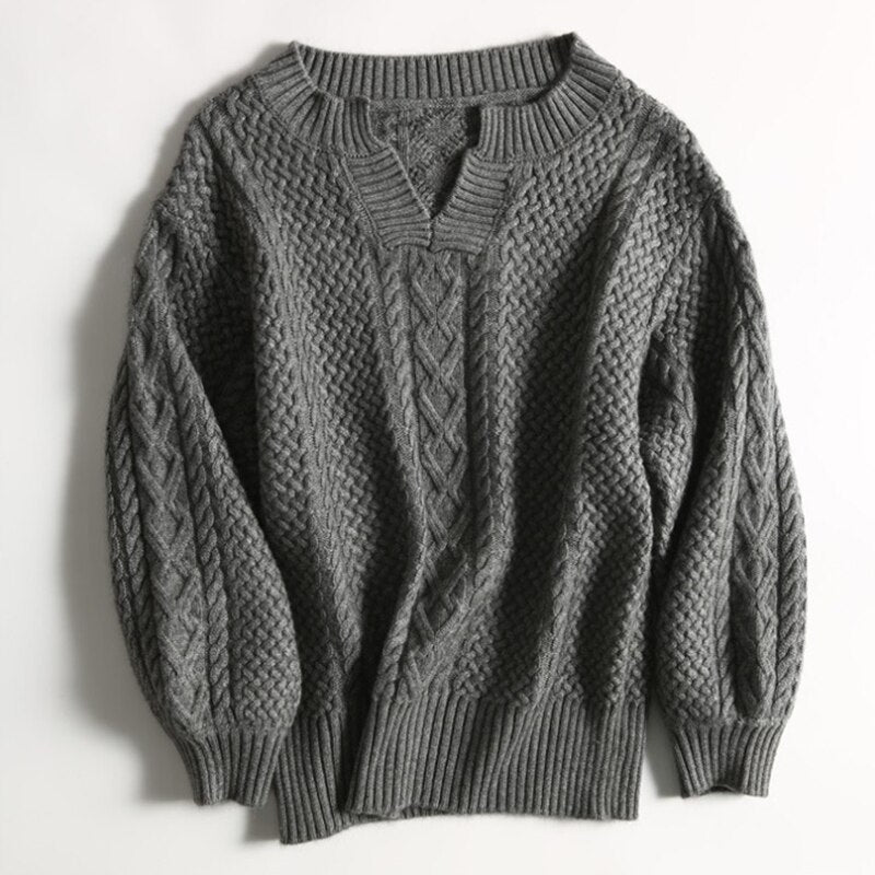 "Ademende wollen trui met uniek kabelpatroon, stijlvolle winterkleding voor dames, verkrijgbaar in diverse kleuren."