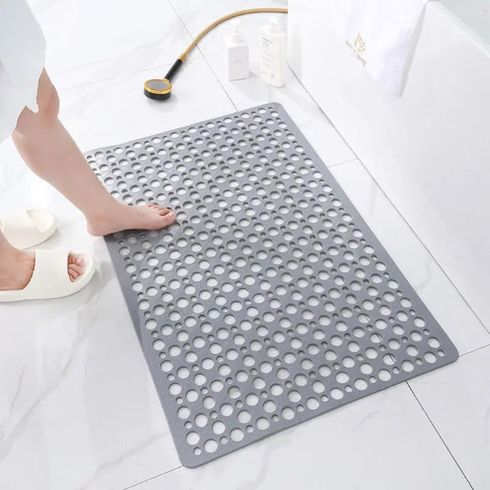 Veilige badmat met zuignappen voor douche en bad, voorkomt uitglijden en biedt comfort. Essentieel accessoire.