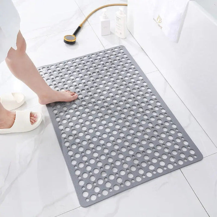Veilige badmat met zuignappen voor douche en bad, voorkomt uitglijden en biedt comfort. Essentieel accessoire.