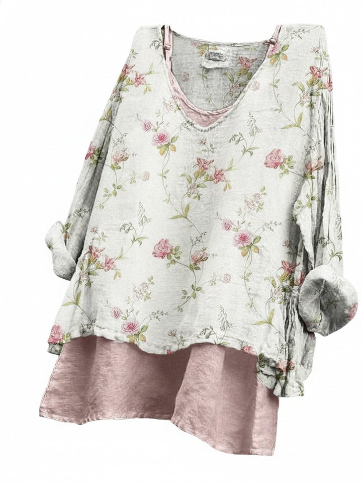Beige damesblouse met bloemenprint, lange mouw en V-hals. Casual chic gelaagde look, perfect voor lente mode.