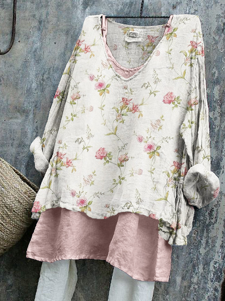 Oversized damesblouse met gelaagde look, bloemenprint en V-hals. Comfortabele lente blouse met lange mouw.