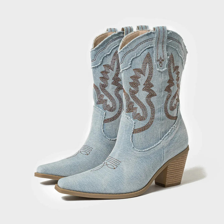 Blauwe dames cowboylaarzen in robuuste western stijl met puntige neus, ideaal voor festivals en casual mode.