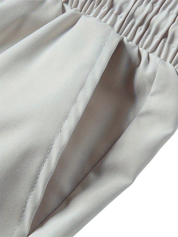 "Casual chique heren joggingbroek, donkergrijs, ademende stof, elastische tailleband met trekkoord, comfortabele pasvorm."