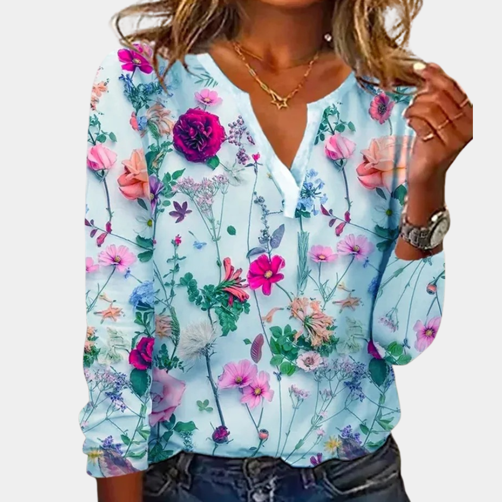 Casual gebloemde damesblouse met levendig bloemmotief, luchtig ontwerp, ideaal voor lente en zomer.