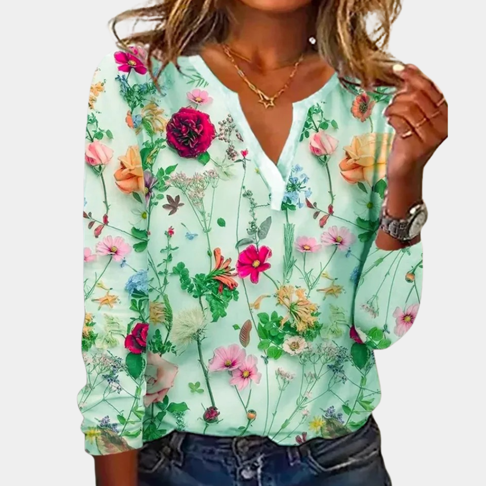 Casual gebloemde damesblouse met levendig bloemmotief, luchtig ontwerp, ideaal voor lente en zomer.