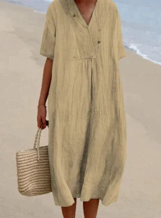 Eenvoudige en elegante casual midi jurk voor dames. Tijdloos ontwerp met ronde hals en korte mouwen.