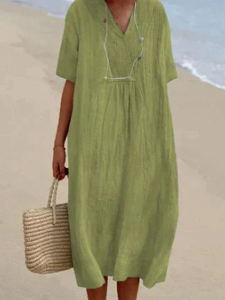 Elegante en veelzijdige midi zomerjurk voor dames. Perfect voor casual gelegenheden of een zomerse avond.