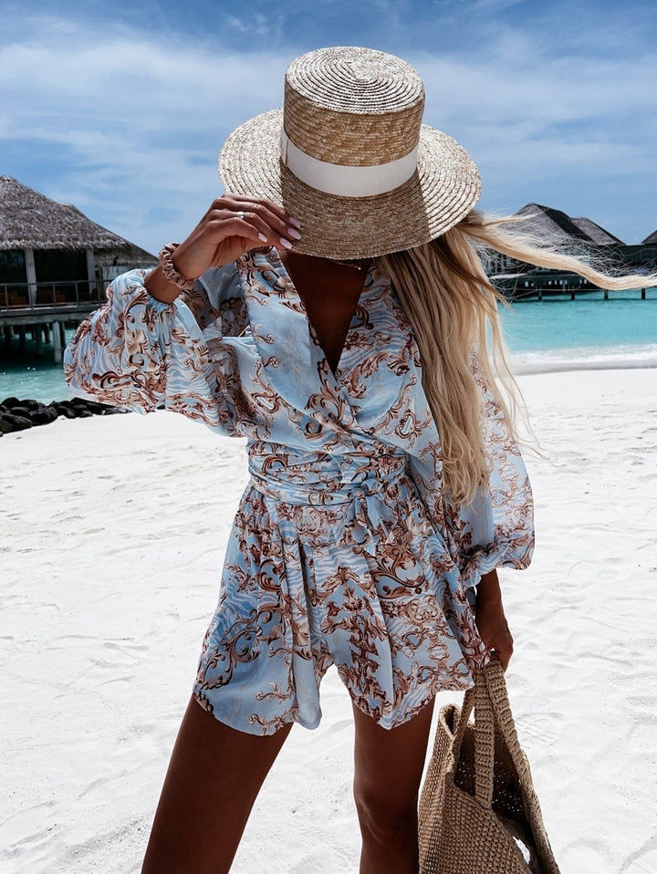 "Chiffon playsuit met tropische print, diepe V-hals, wijde mouwen en elastische taille, ideaal voor zomerse stijl."