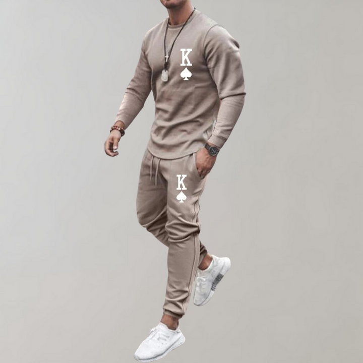 Wit herentrainingspak, strak design, perfect voor een sportieve look of als casual outfit.
