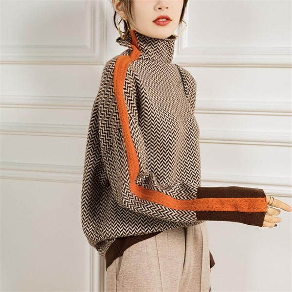 Comfortabele dames gebreide trui met oranje en groene strepen, perfect voor winterse casual mode.