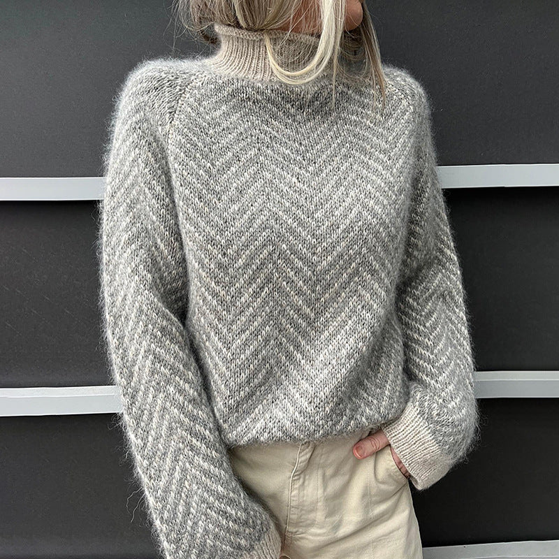 Comfortabele grijze dames coltrui met elegant visgraatpatroon en hoge hals, perfect voor wintermode