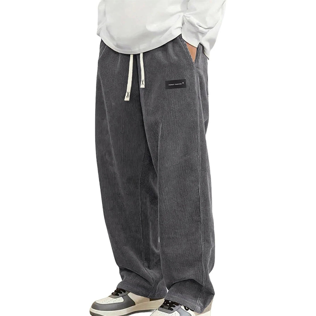 Veelzijdige heren jogger broek met wijde pijp en geribbelde textuur, geschikt voor dagelijks casual comfort.