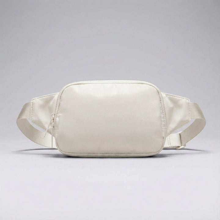 Duurzame nylon fannypack voor dames en heren, veelzijdig te dragen als heup- of schoudertas.