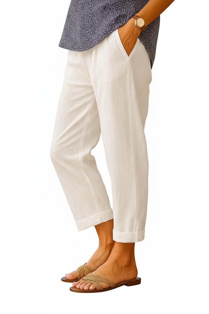 Dames 7/8 broek met rechte pijp en zijzakken, ideaal voor casual comfort en elegantie.