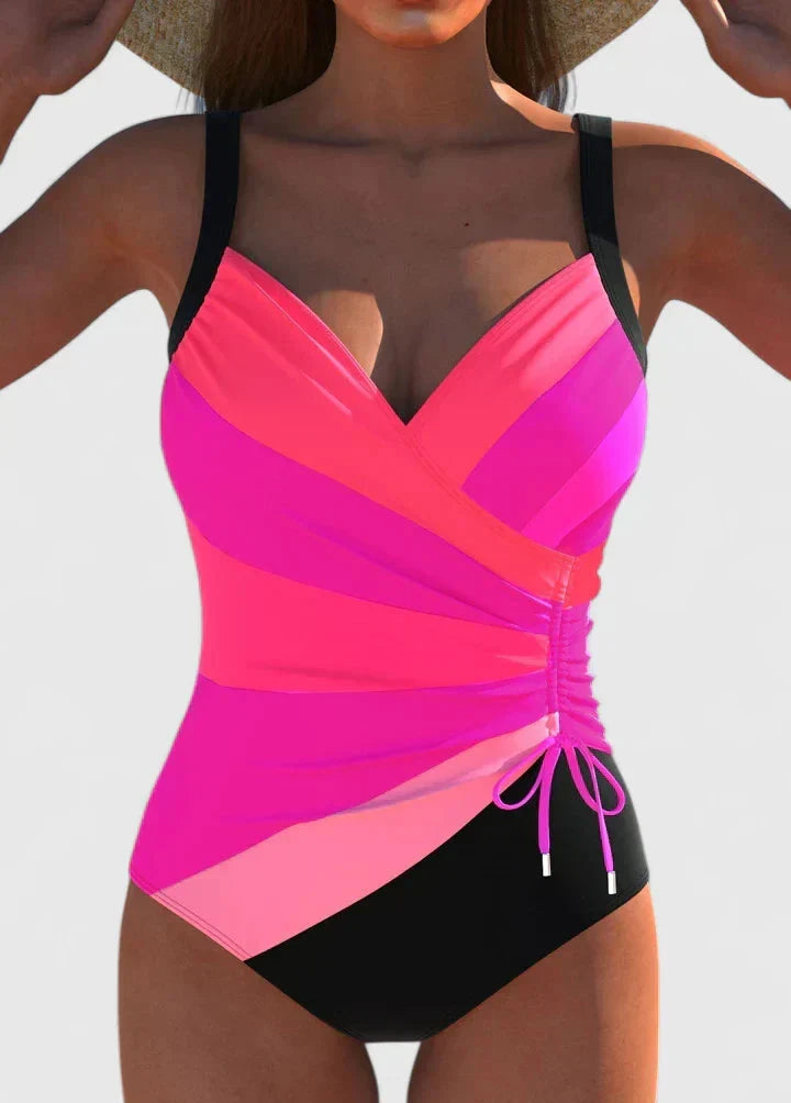 Elegant damesbadpak met diepe V-hals, wrap-around top en verstelbare details voor optimale pasvorm.