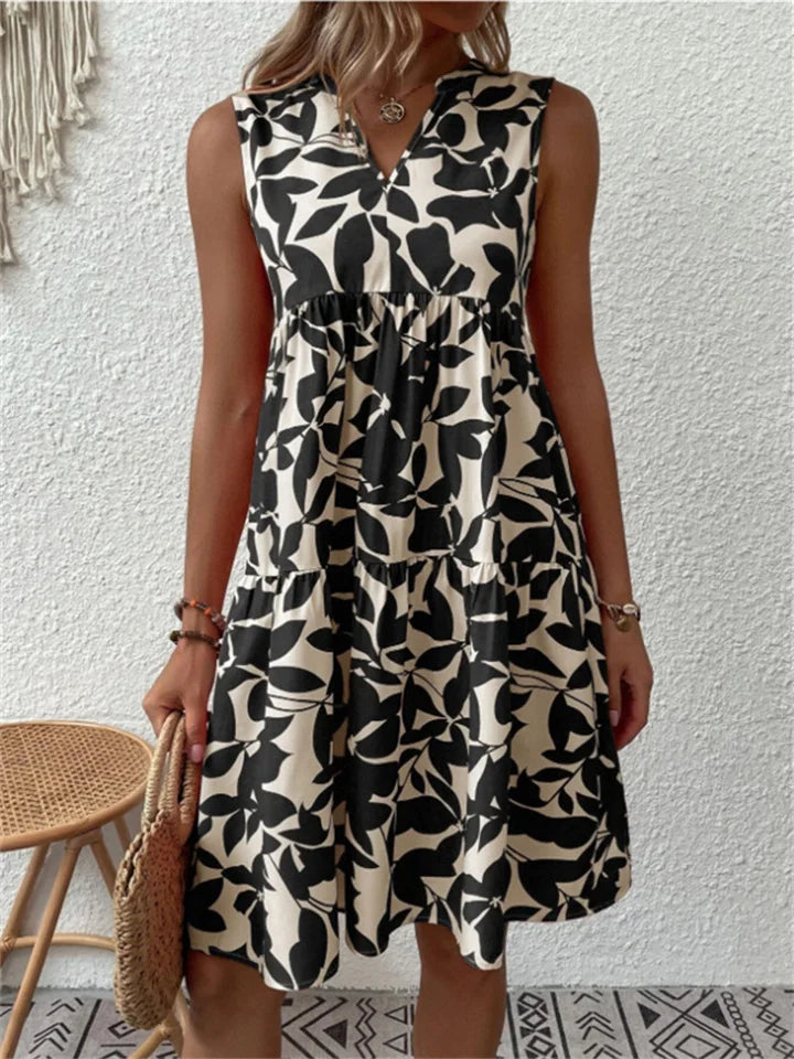 Deze comfortabele en stijlvolle dames bloemen midi zomerjurk is een must-have voor elke garderobe.