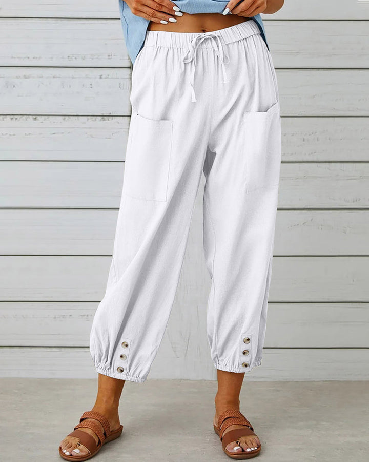 Comfortabele dames broek met knoopdetails. Hoge taille en rechte pijpen voor een relaxte pasvorm.