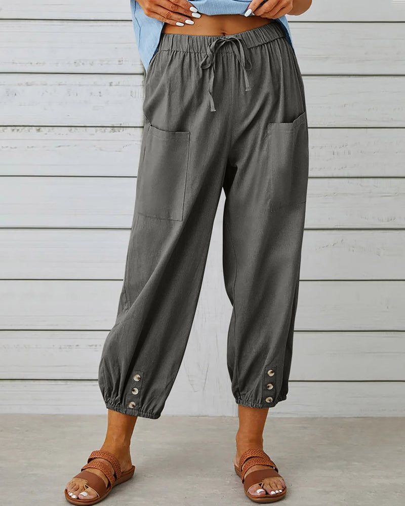 Elegante lente/zomer damesbroek met hoge taille en rechte pijpen, verfraaid met unieke knoopdetails.