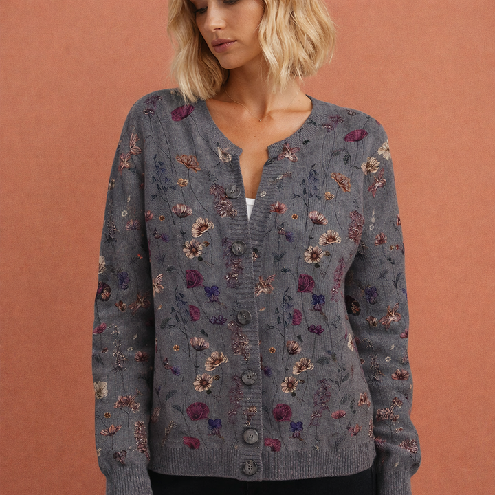 Stijlvolle dames cardigan met verfijnde bloemenprint, warm en chique voor wintermode.