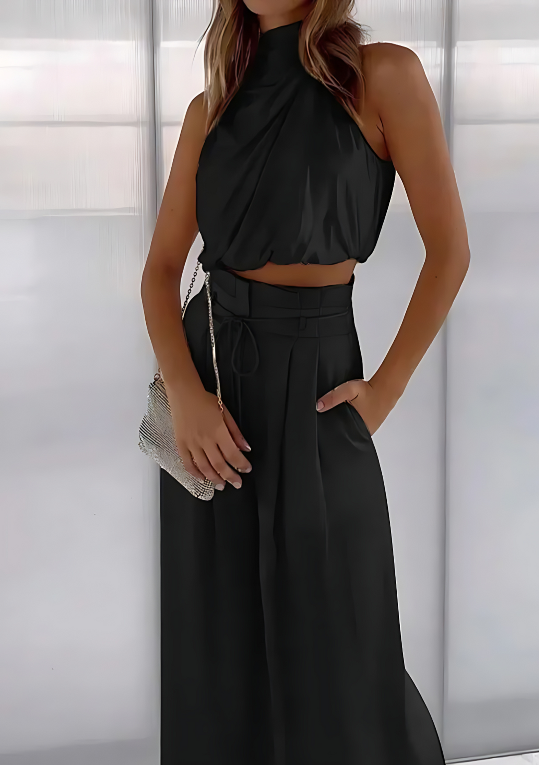 Elegante dames mouwloze top en flowy wijde pijpen broek zomerset. Een must-have voor modieuze vrouwenkleding.