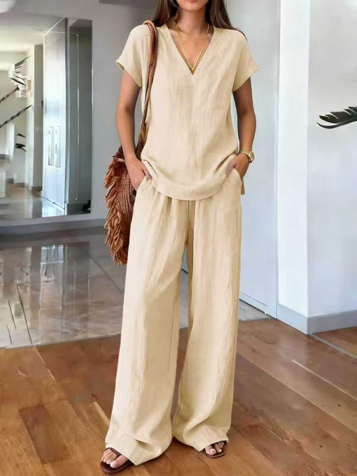 Veelzijdige dames linnen tweedelige set. Casual V-hals blouse en ademende broek, ideaal voor warme dagen.