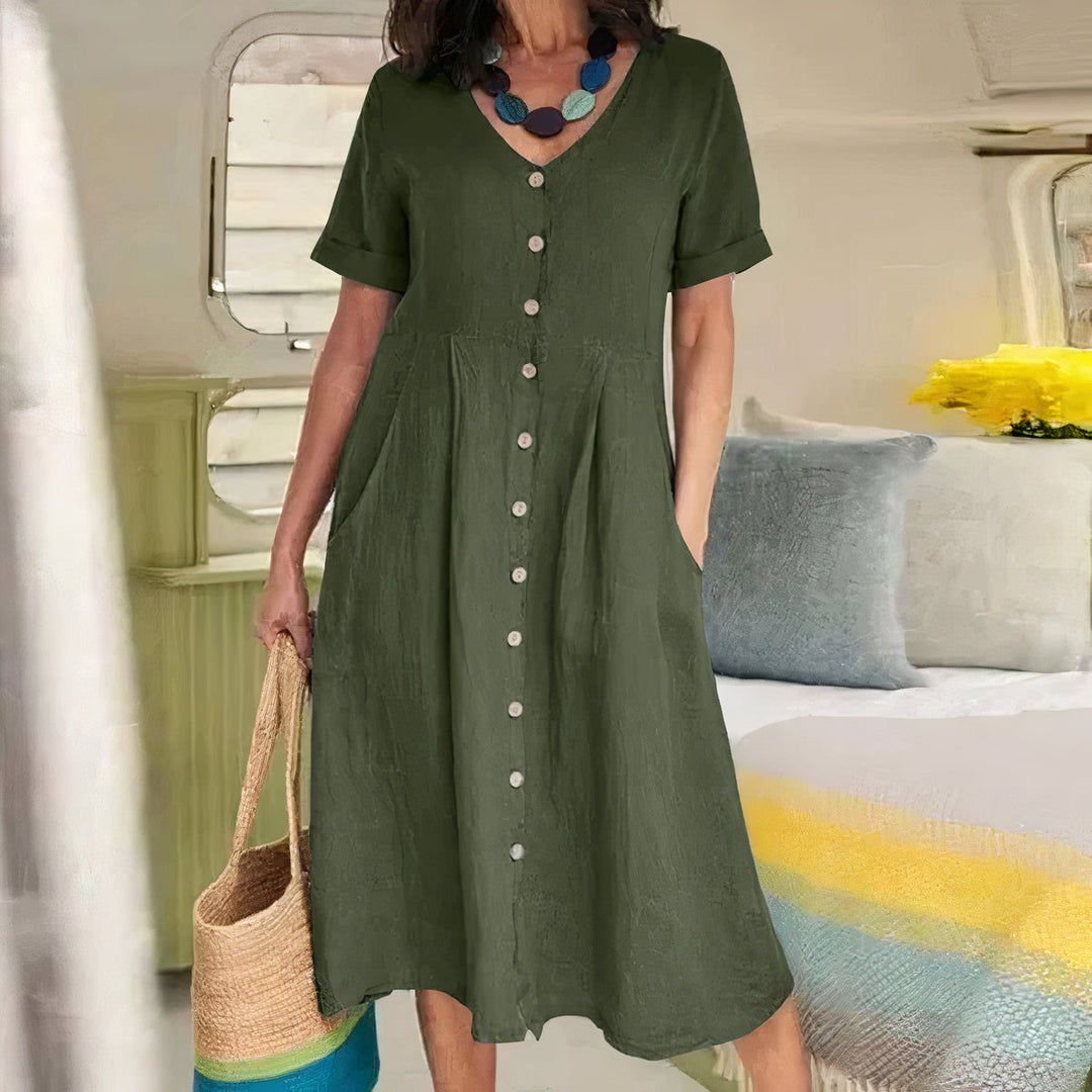Elegante casual dames jurk, midi lengte, met V-hals en een chique knoopsluiting.