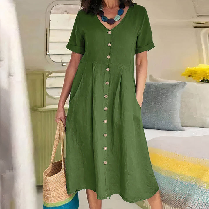 Chic casual dames jurk, midi lengte, met V-hals en een stijlvol knoopdetail als blikvanger.