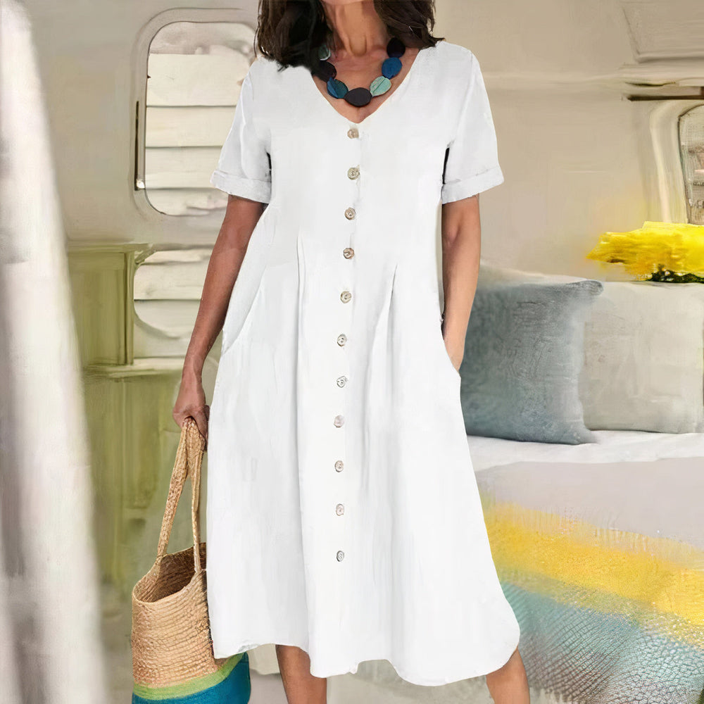Elegante zomerjurk voor dames, midi lengte, met V-hals, knoopdetail en A-lijn pasvorm.