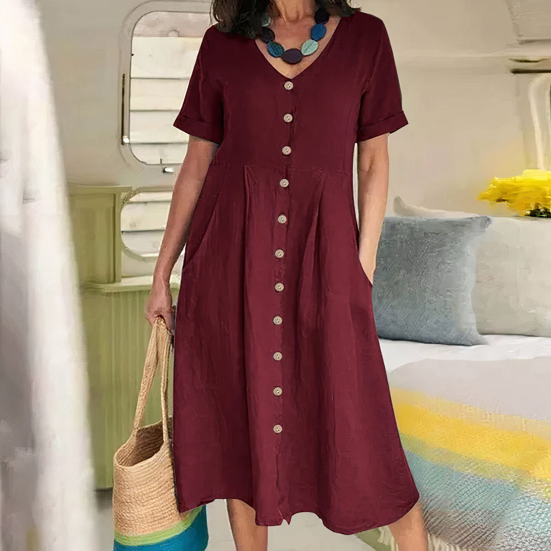 Stijlvolle casual jurk voor dames, midi lengte, met V-hals en verfijnd knoopdetail.
