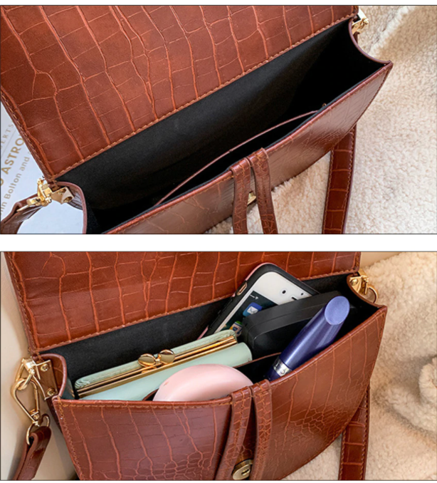 Close-up van de luxe krokodillenprint textuur op deze stoere Chelsey crossbody tas.