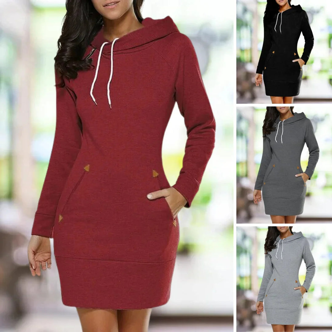 Dames hoodie jurk met capuchon, lange mouwen en ruime zijzakken. Knielange, comfortabele herfstmode.