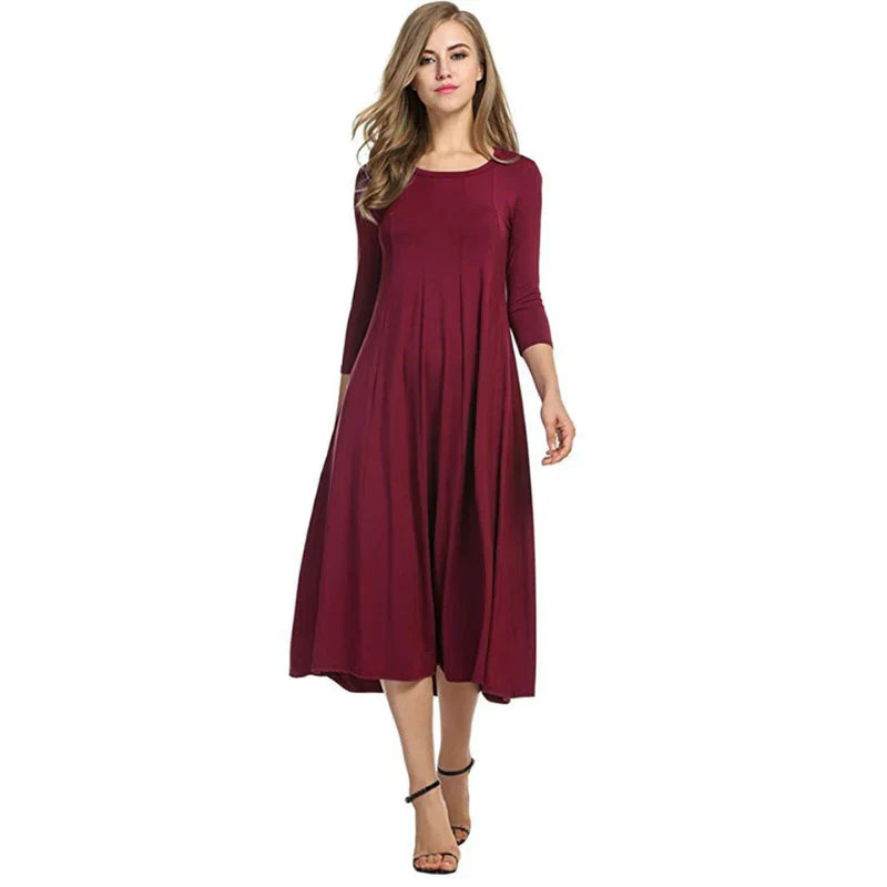 Dames driekwart midi zomerjurk, comfortabel en stijlvol. Ideaal voor elegante zomermode.