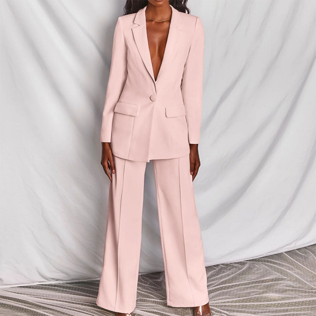 Damespak met elegante blazer en rechte broek. Perfect voor een chique en zakelijke dameslook.