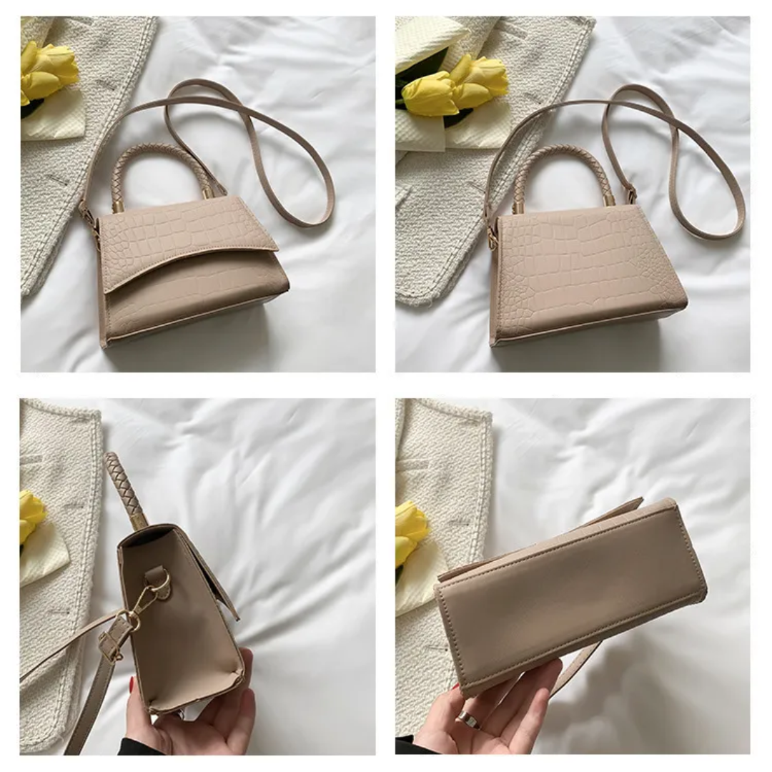 Tijdloze elegante dameshandtas in zwart, met bovenhandvat. Perfecte modieuze accessoire voor elke vrouw.