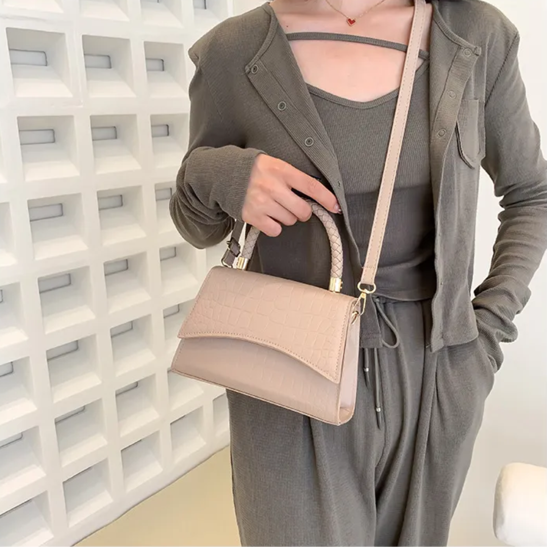 Modieuze zwarte dameshandtas met elegant bovenhandvat. PU-leren tas, ideaal voor elke outfit.