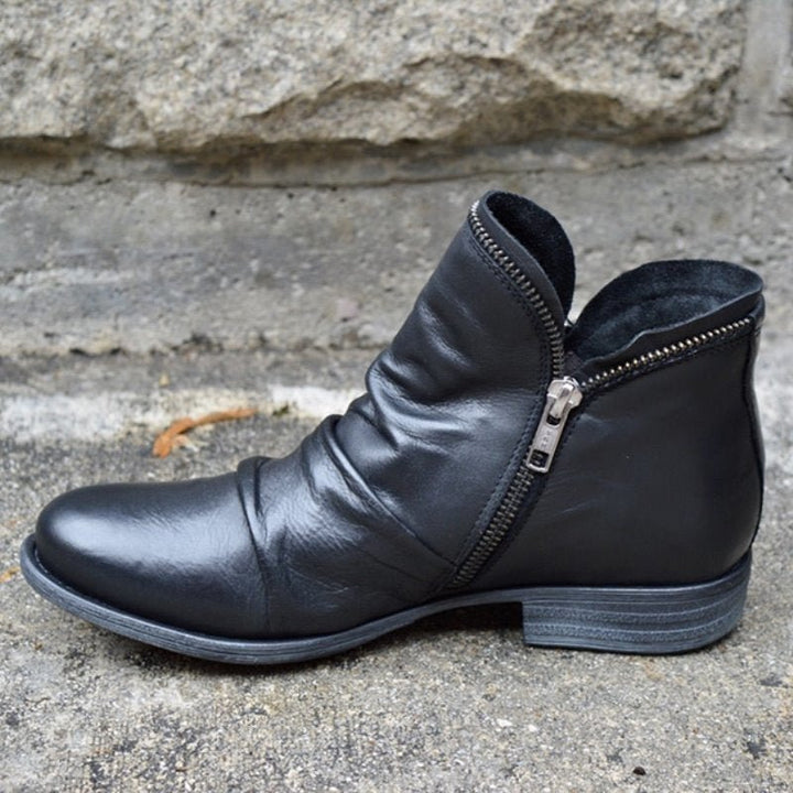 Elegante dameslaarzen met stevige blokhak en handige zijrits. Geschikt voor dagelijks comfort en een chique look.
