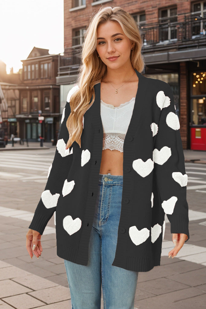 Elegant damesvest met unieke hartjesprint, veelzijdig te dragen voor zowel voorjaar als najaar, casual of chic.