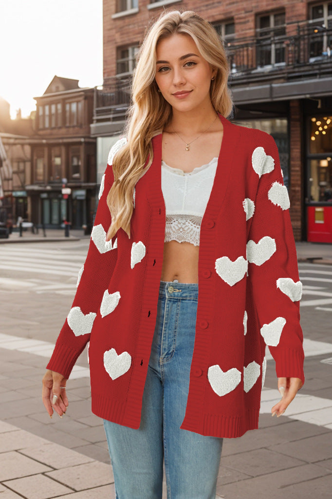 Comfortabel dames gebreid vest met hartjesprint, perfecte bovenkleding voor een trendy en warme voorjaars- of najaarsdag.