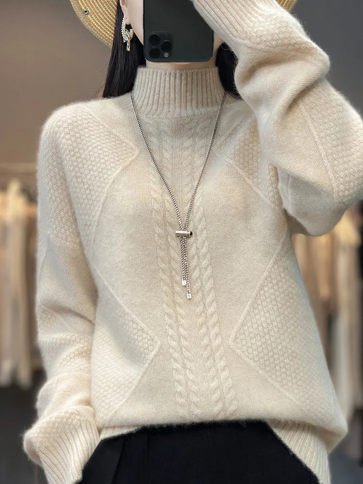 Dames gebreide coltrui met elegant kabelpatroon voor warmte en stijlvolle herfstlooks.