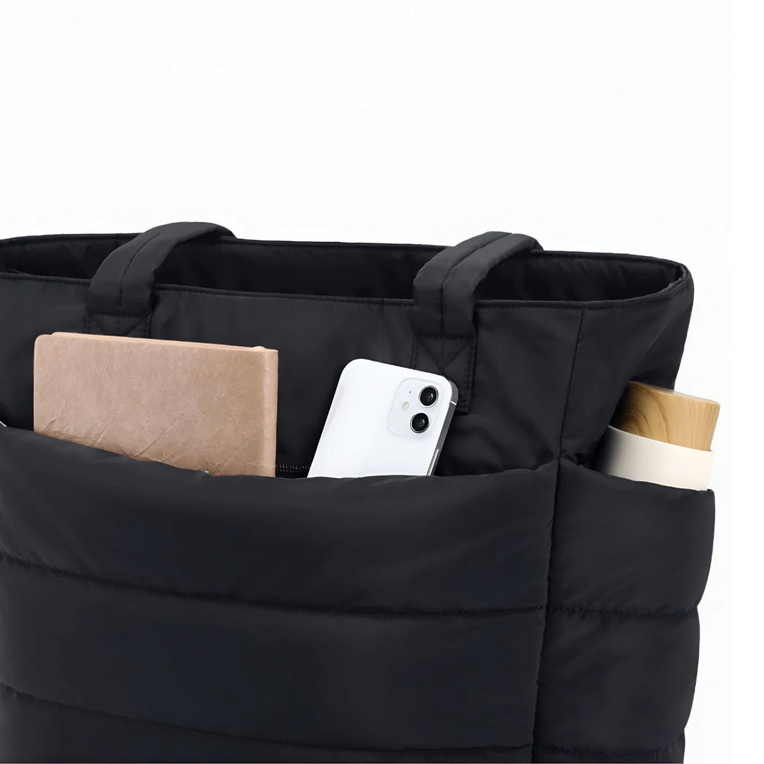 Ruime gewatteerde werktas/schooltas voor dames, comfortabel en praktisch in puffer stijl.