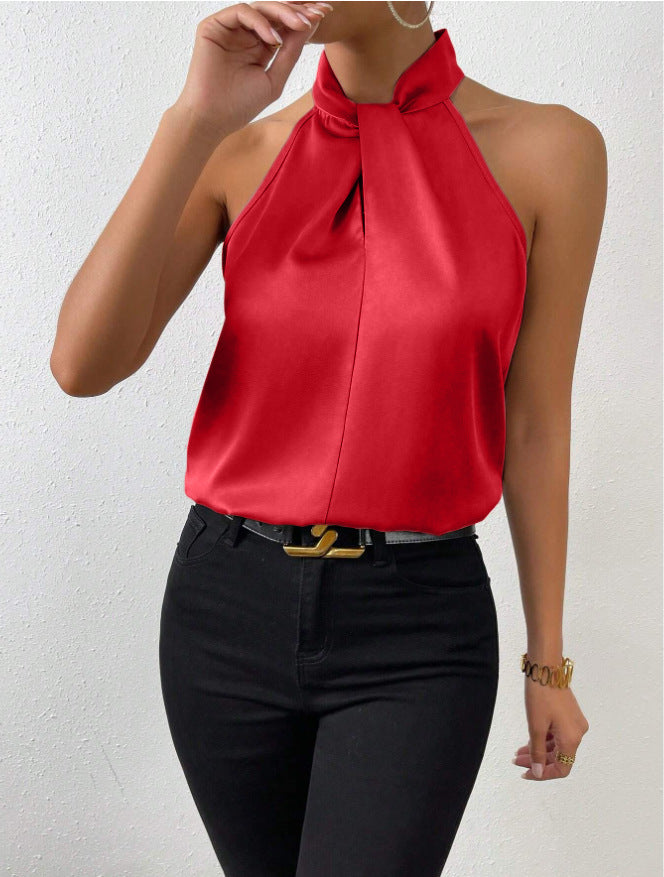 Dames top met gedraaide hals, mouwloos en elegant. Chique haltertop voor zomerse casual mode.