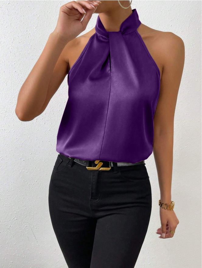 Comfortabele mouwloze dames haltertop met gedraaide hals. Ademende zomer top voor warme dagen.