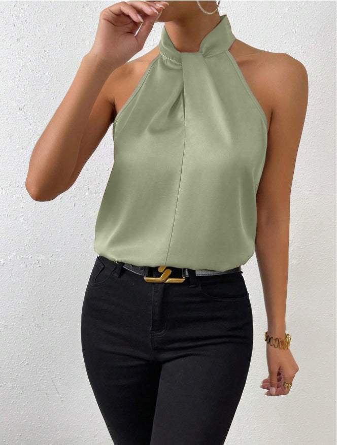 Dames haltertop, mouwloos en met gedraaide hals. Perfect te combineren voor een trendy zomerlook.