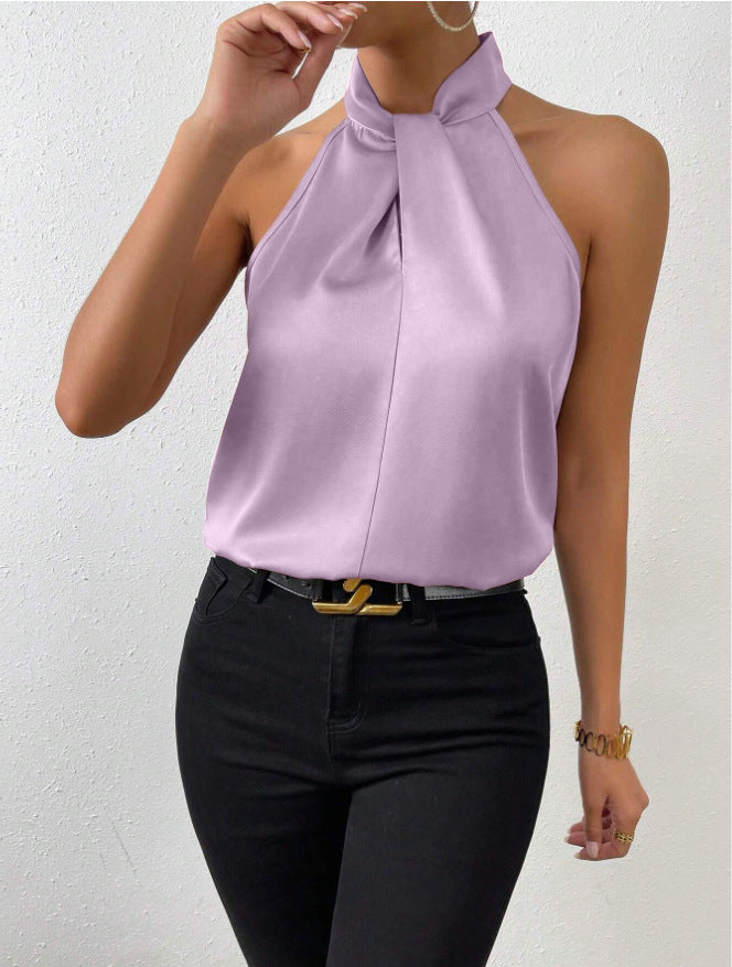 Fashion statement: dames haltertop mouwloos met gedraaide hals, voor een zelfverzekerde chique zomerlook.