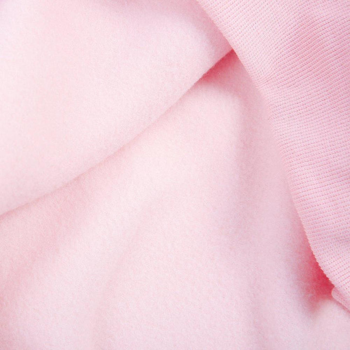 Trendy roze dames hoodie met knoopsluiting en voorzak, perfect voor comfortabele herfst- en lentemode.