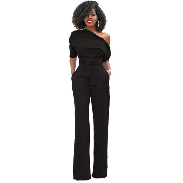 Dames jumpsuit: comfortabel ontwerp met wijde pijpen, open schouder en strikband accent.