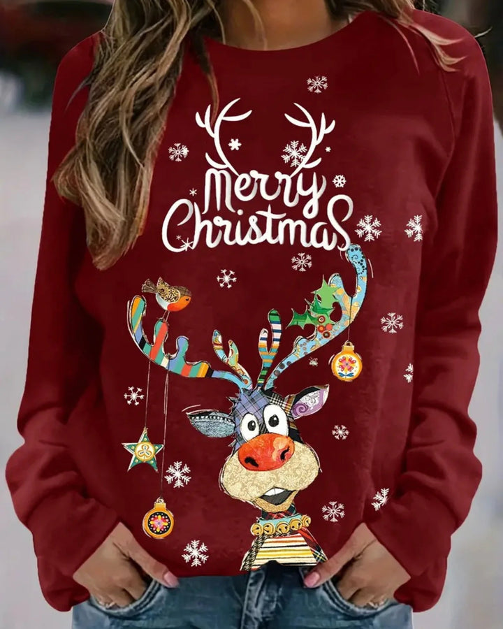 Casual dames wintertrui met rendierdesign. Zachte stof en raglanmouwen voor extra comfort.