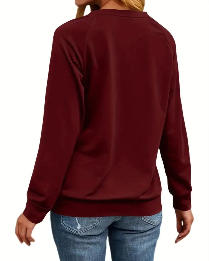 Dames wintertrui met kerstthema: rendierprint en zachte stof. Ideale casual outfit voor de feestdagen.