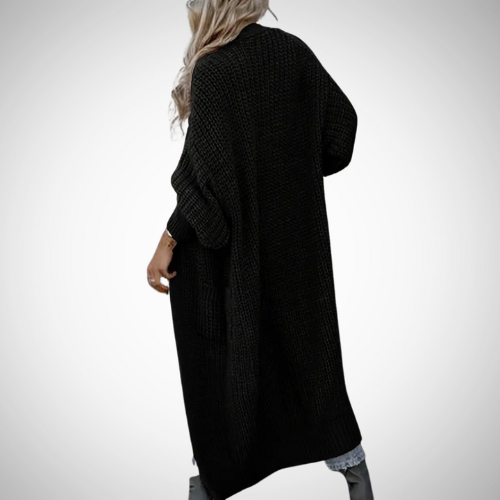 Veelzijdig lang damesvest met zakken, openvallend model. Geschikt voor diverse looks in herfst/winter.