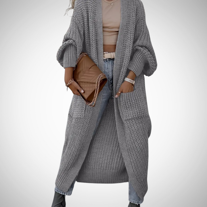 Stijlvol lang damesvest met praktische zakken, open design. Essentieel item voor de herfstgarderobe.